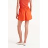 Short botones naranjas